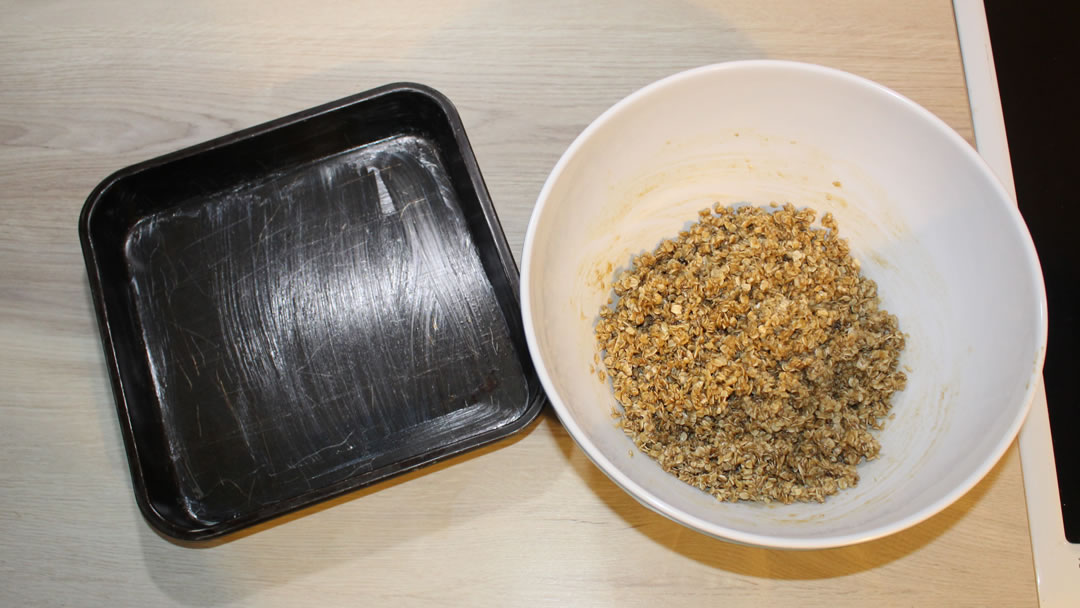 The mixture is ready to be placed evenly into a greased square baking tin