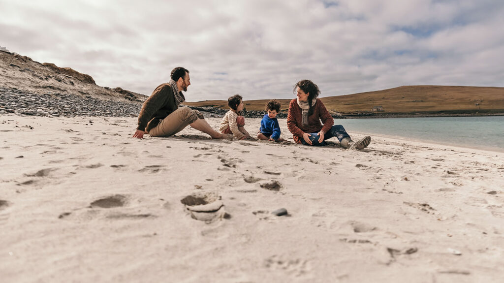 Family on Minn beach in Shetland
