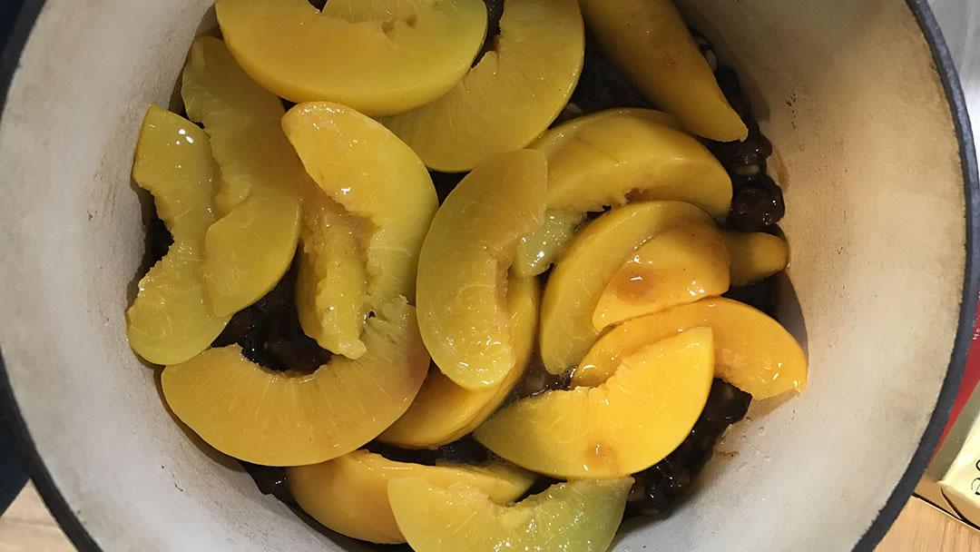 Mincemeat and peaches in a greased oven dish