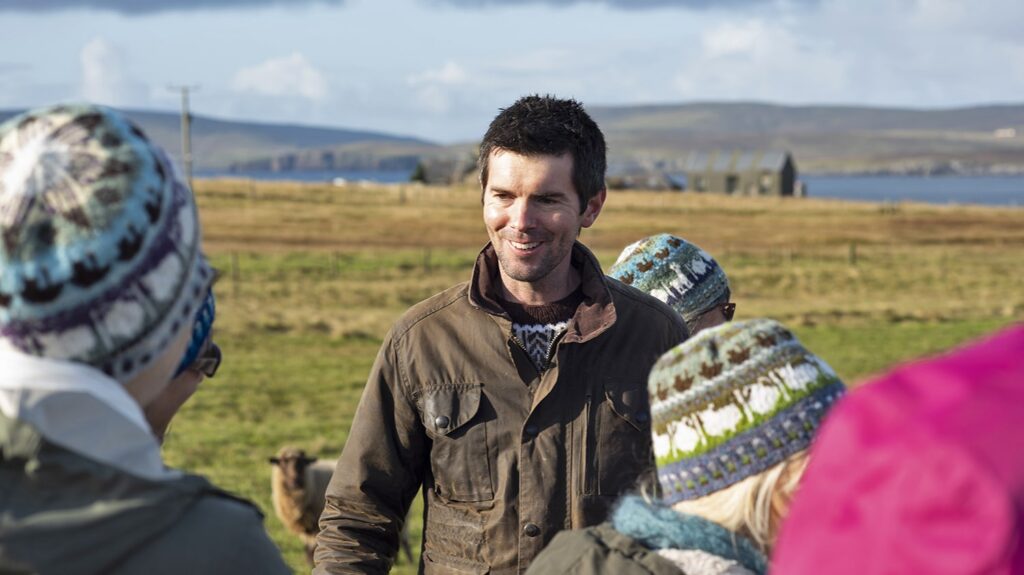 Chris showing visitors around his farm