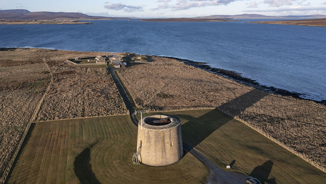 The Martello Tower at Hackness, and the tower at Crockness in the distance, viewed from the air