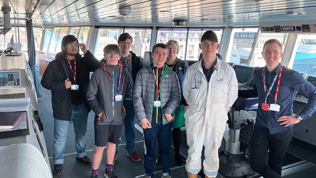 Enable Works enjoying a tour of the MV Hrossey bridge with Bobby Moffat, Deck Cadet, and Fiona Anderson, Aberdeen Customer Service Manager
