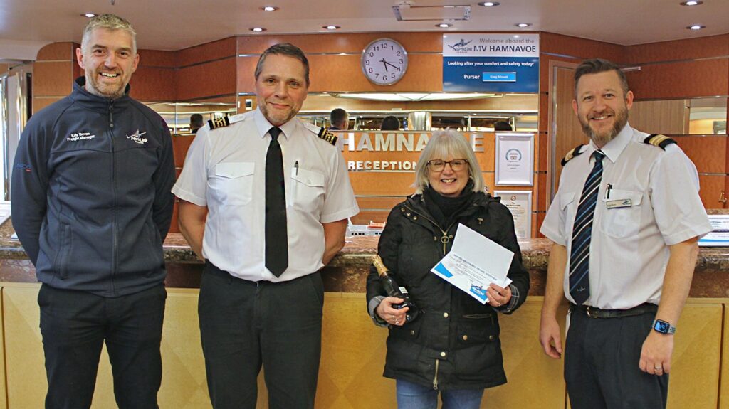 NorthLink Ferries staff with the 200,000th passenger on the MV Hamnavoe
