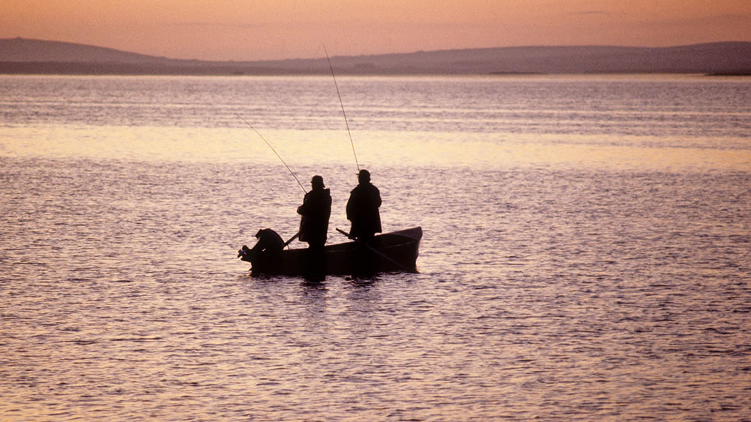 Fishing from a boat on the Loch of Harray, Orkney