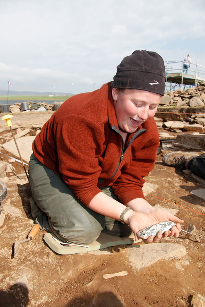 Jo one of our American students lifts an exceptional polished stone axe