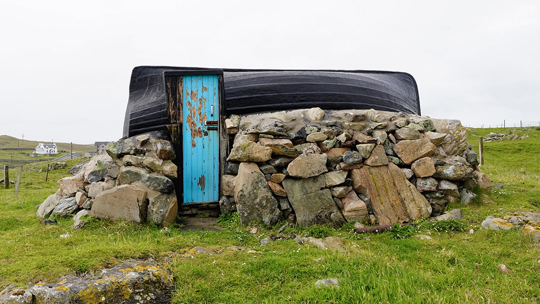 A unique structure in the Out Skerries featuring a boat as a roof!