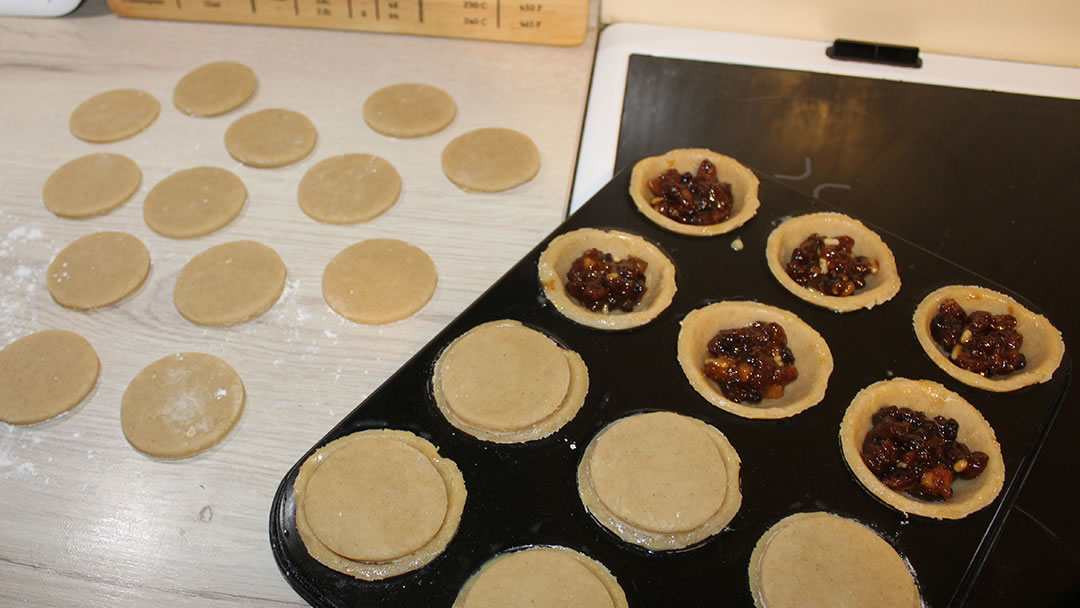 FIll the pastry with mincemeat and enclose with a pastry lid