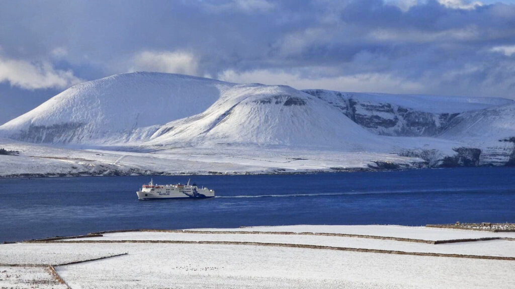 MV Hamnavoe sailing past the stunning, snow-covered Hoy Hills photo © Copyright Freya Butcher