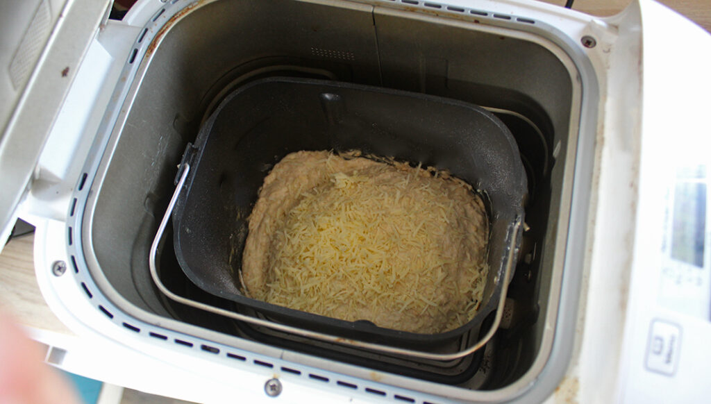 Sprinkle the remaining cheese onto loaf before it has finished cooking
