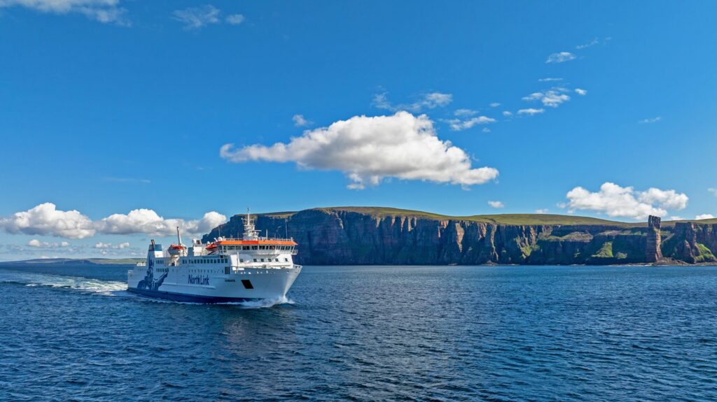 The MV Hamnavoe sailing past the Old Man of Hoy