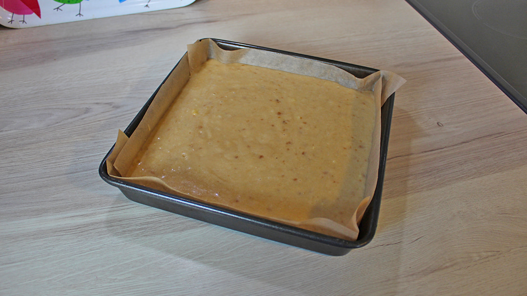 Pour the mixture into a lined baking tin
