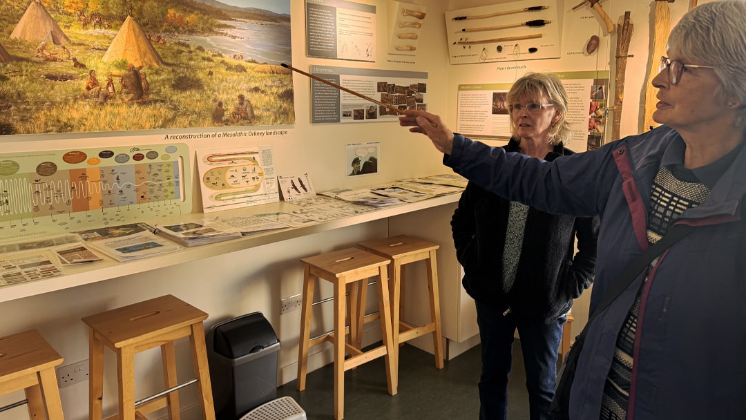 Freda and Kathleen explaining the history of the Tomb of the Eagles