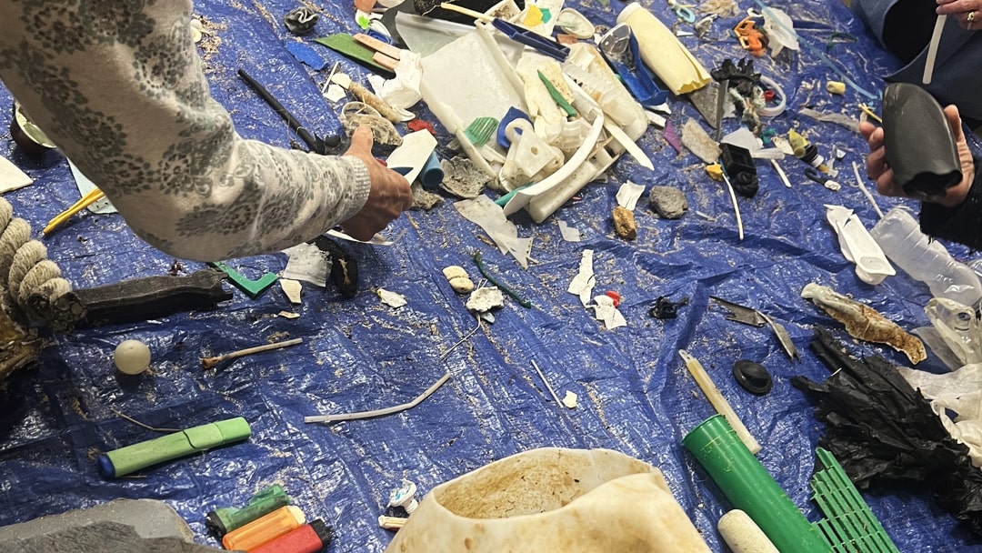 Surveying the latest marine litter haul from Lopness, Sanday