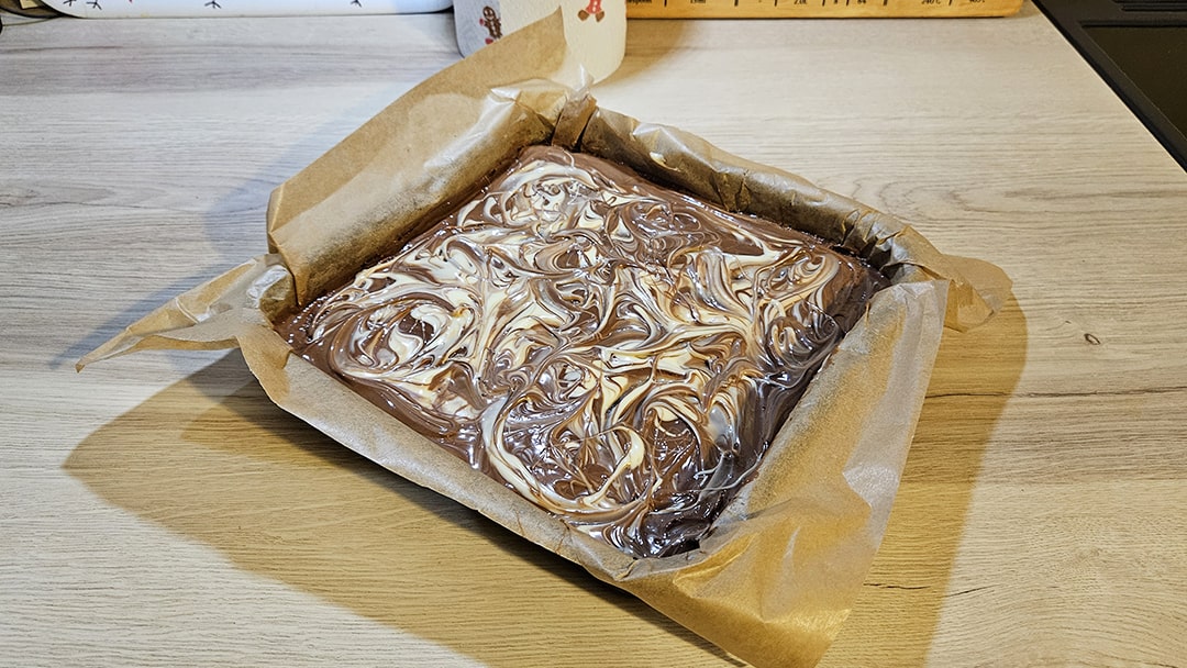 Pour melted chocolate over the top and swirl to create a pattern