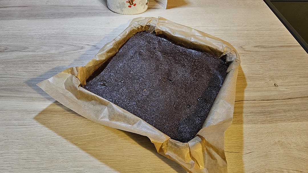 Press the base mixture into a lined baking tin