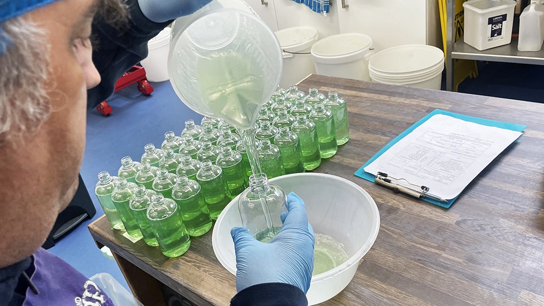 Robbie hand pouring the soaps