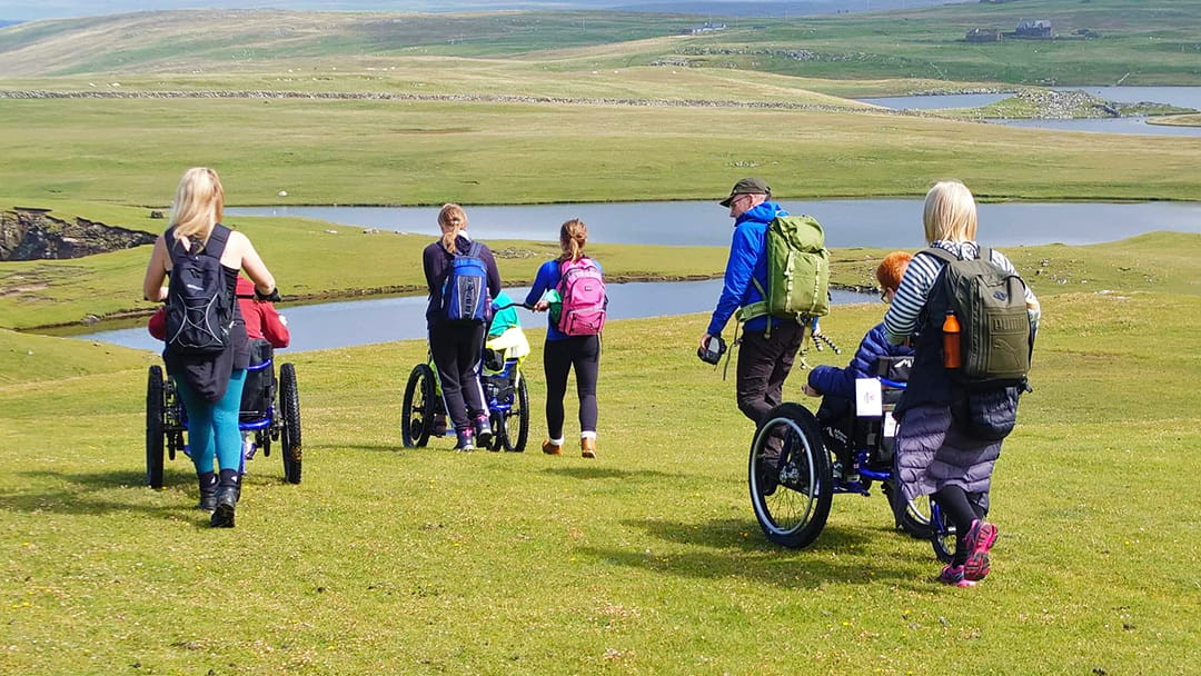 Exploring Shetland in all-terrain wheelchairs at Eshaness