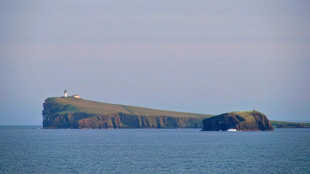 The sloping island of Copinsay in Orkney
