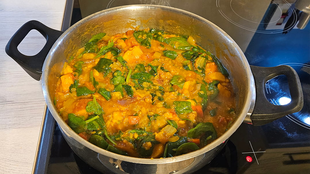 Once cooked through, add the spinach in small handfuls until wilted