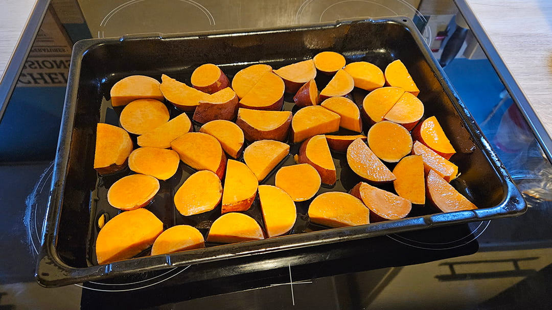The washed, chopped sweet potatoes ready to go in the oven