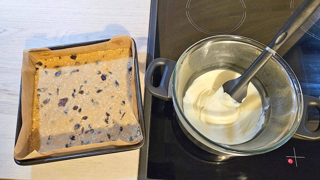 Melt the remaining white chocolate and pour on top of chilled base