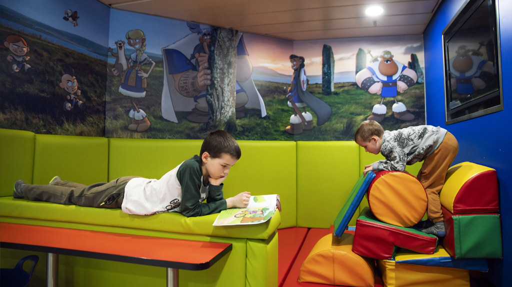 Children playing in the Viklings Den on board