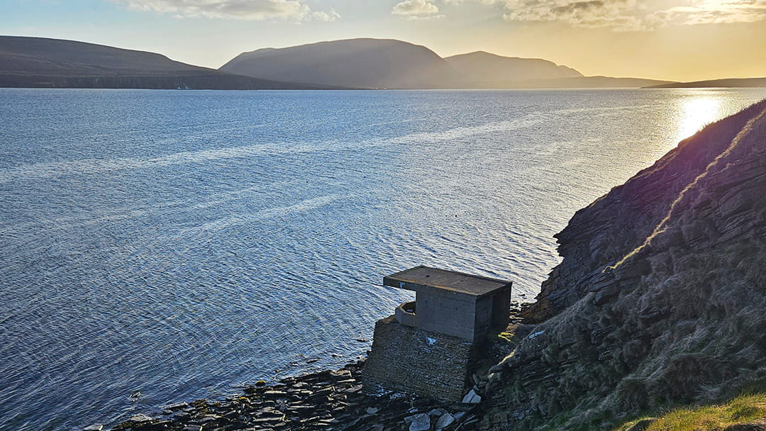 Wartime searchlights along the shore at Houton