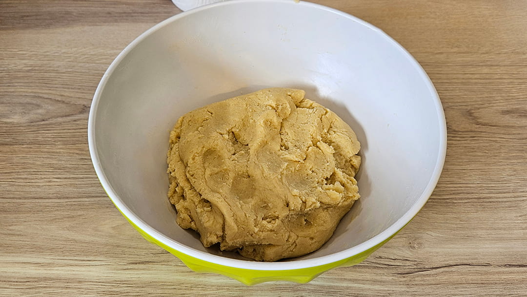 Knead the mixture together then roll out flat