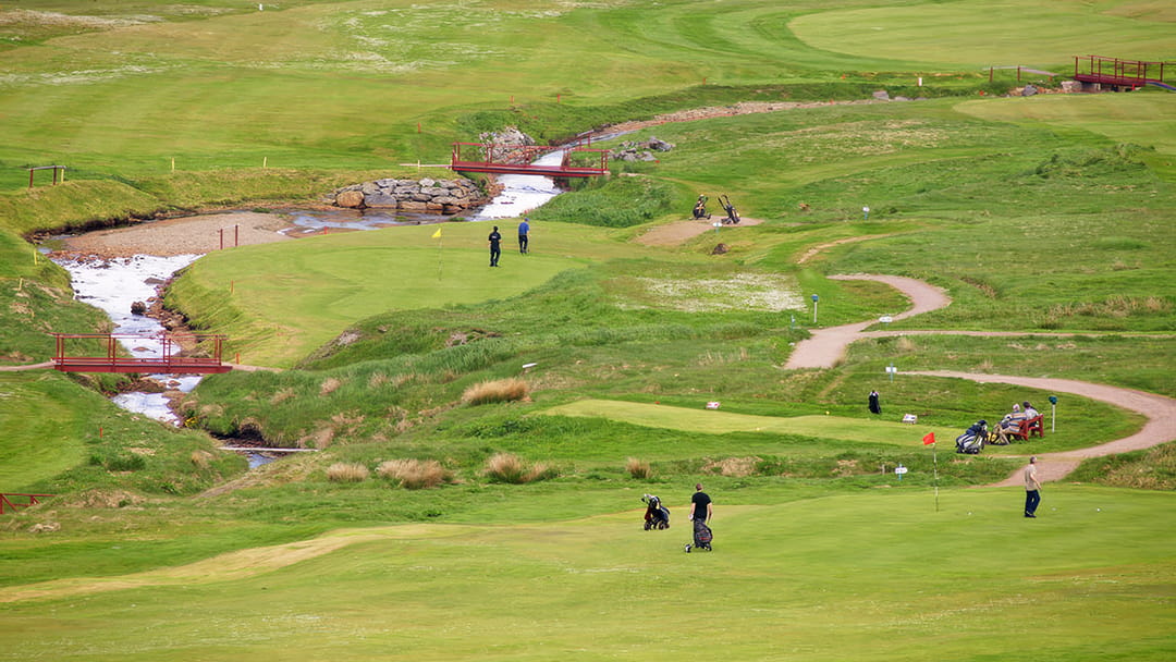 Golfers playing at Shetland Golf Club