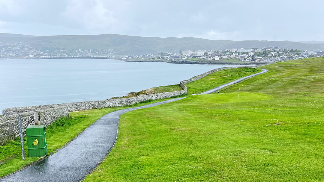 The Knab Golf Course and view across Breiwick Bay