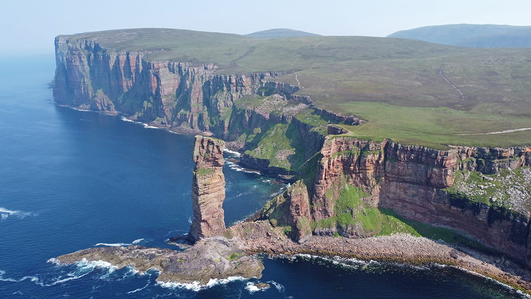 The Old Man of Hoy with St John's Head cliffs in the background