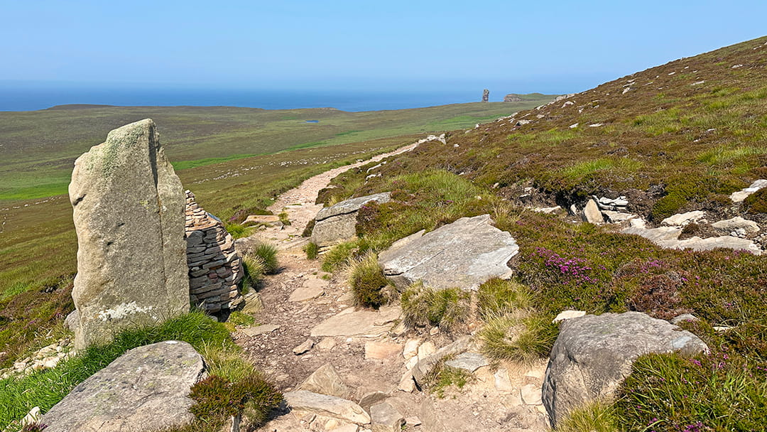 The first glimpse of the Old Man of Hoy, peaking over the cliffs