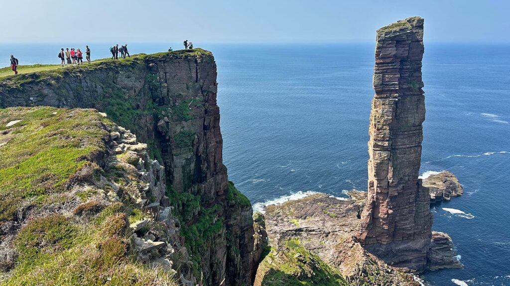 Walkers admiring the Old Man of Hoy