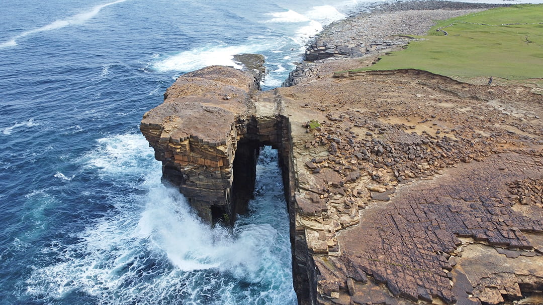 The Hole o'Rowe next to the Bay of Skaill from above